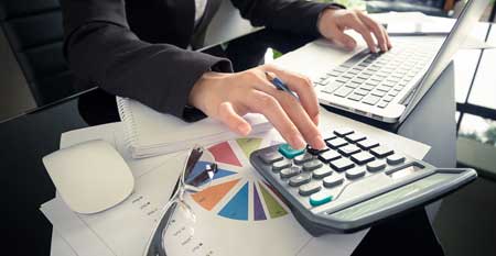 An accountant calculates a business's profit and loss.