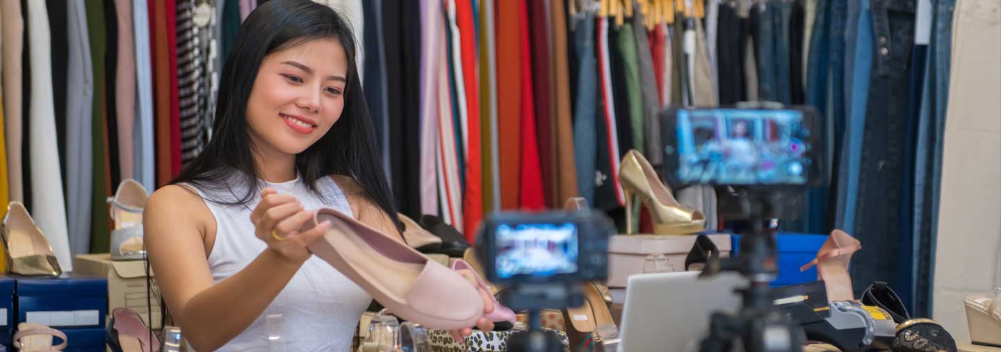 An entrepreneur photographs products for her online store.