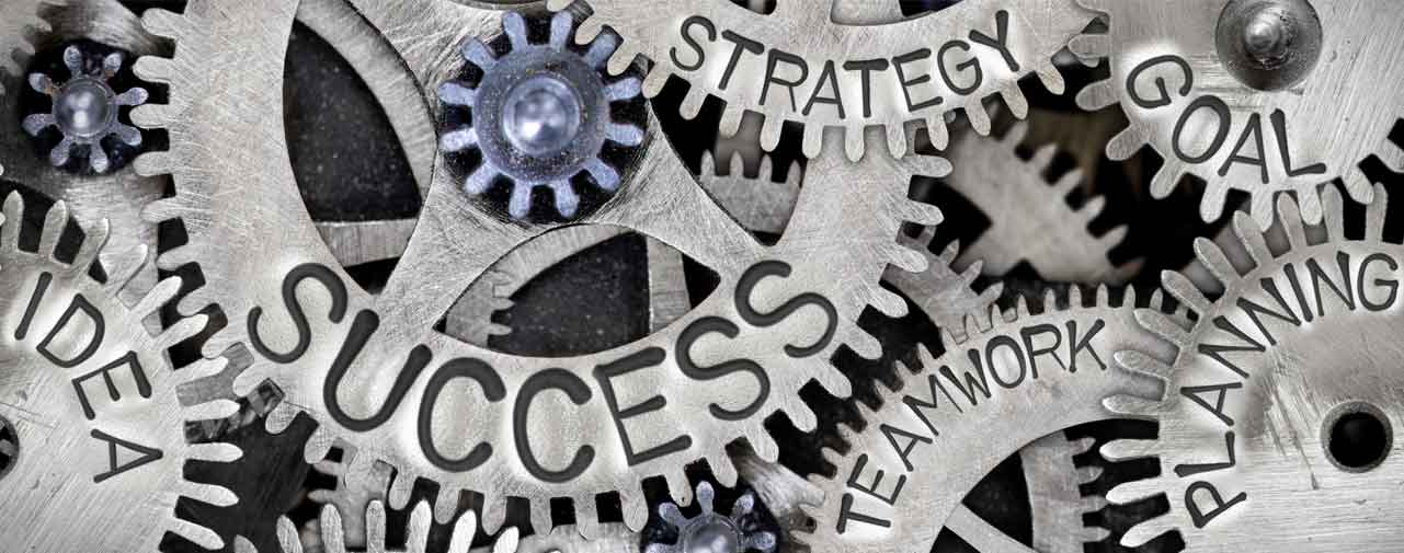 A series of gears with the words idea, success and strategy engraved in them.